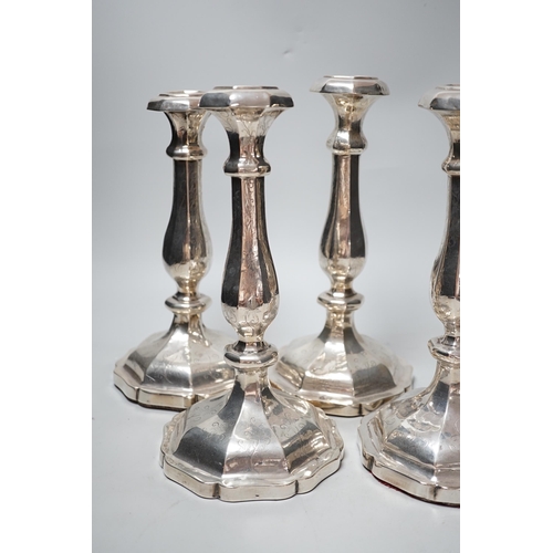 1803 - A set of four 19th century Austro-Hungarian white metal candlesticks, dated 1863, height 27.4cm, et ... 