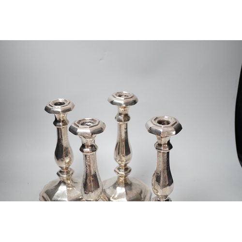 1803 - A set of four 19th century Austro-Hungarian white metal candlesticks, dated 1863, height 27.4cm, et ... 