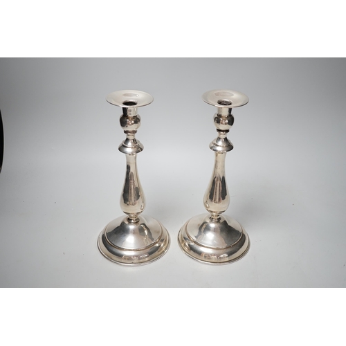 1804 - A pair of continental white metal candlesticks, stamped SK 900, height 25.3cm, gross 18.3oz.