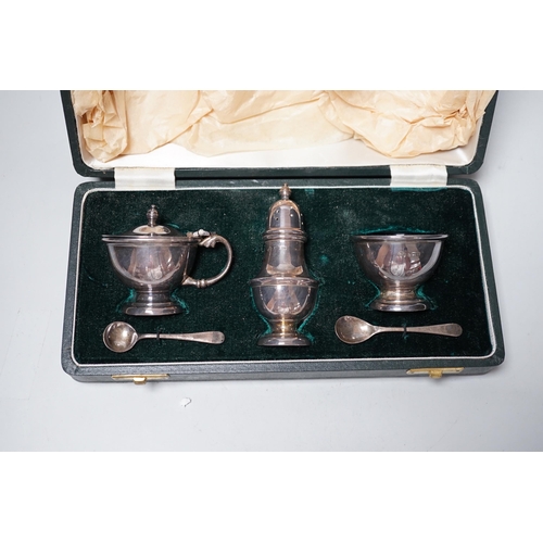 1820 - An Elizabeth II cased silver three piece condiment set, Elkington & Co, Birmingham, 1963 and two sil... 