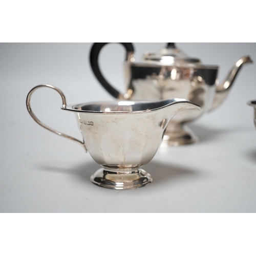 1825 - A George V silver three piece tea set, Viners Ltd, Sheffield, 1931, gross 21.8oz.