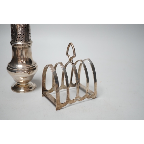 1831 - A modern silver sugar caster, 16.5cm and a George V silver toast rack, 8.7oz.