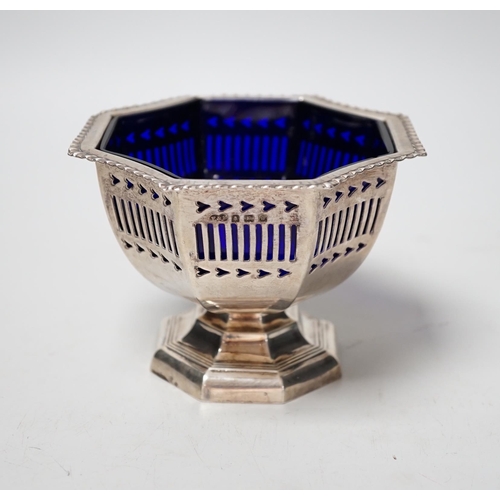 1832 - A George V pierced silver sugar bowl, with blue glass liner, Fergenbaum & Son, Birmingham, 1921, dia... 