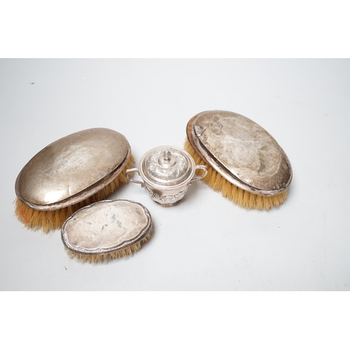 1835 - A small George V silver twin handled cup and cover, London, 1929 and three silver mounted  brushes.... 