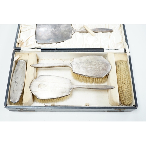 1837 - A 1930's cased engine turned silver mounted six piece mirror and brush set, by William Neale & Son L... 