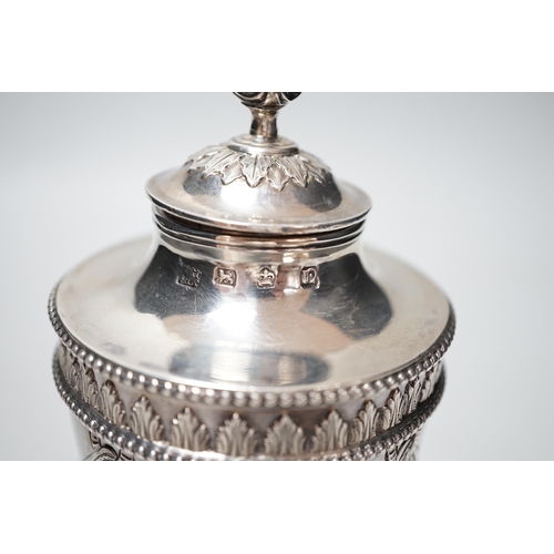 1847 - A George III silver vase and cover, with swag and fern decoration, on square base, with ball feet, R... 