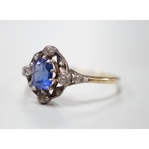 1876 - An early 20th century yellow metal, sapphire and diamond cluster set oval cluster ring, size R/S, gr... 