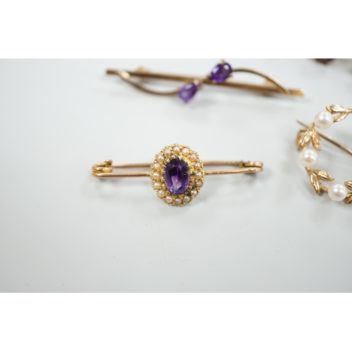 1878 - A 15ct and graduated five stone garnet set bar brooch, 48mm, a similar amethyst and seed pearl clust... 