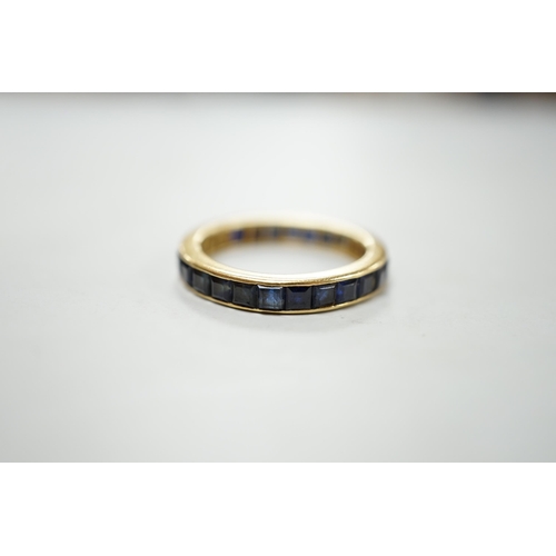 1880 - A yellow metal and sapphire set full eternity ring, size R, gross weight 4.6 grams.