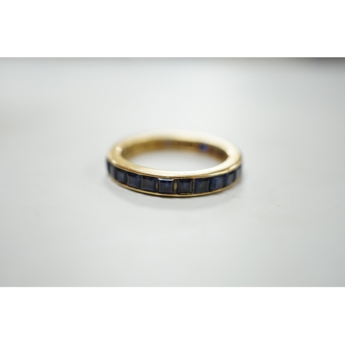 1880 - A yellow metal and sapphire set full eternity ring, size R, gross weight 4.6 grams.