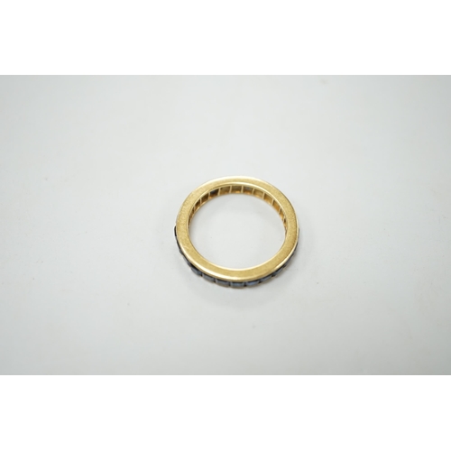 1880 - A yellow metal and sapphire set full eternity ring, size R, gross weight 4.6 grams.