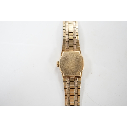 1883 - A lady's Omega 9ct gold manual wind wrist watch, with integral 9ct gold bracelet, gross weight 31.3 ... 