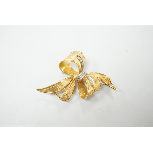 1889 - A 1970's 9ct gold and diamond chip set bow brooch, 51mm, gross weight 11.2 grams.