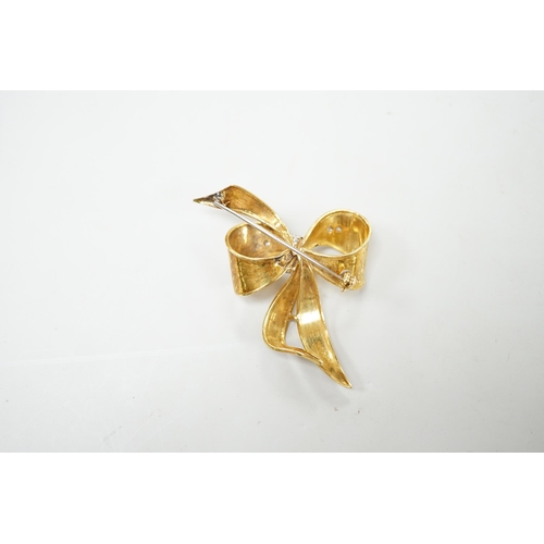 1889 - A 1970's 9ct gold and diamond chip set bow brooch, 51mm, gross weight 11.2 grams.