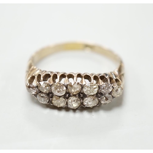 1894 - An 18ct and two row diamond cluster set half hoop ring, size R, gross weight 4.6 grams.