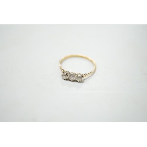 1895 - A yellow metal and three stone diamond set ring, size S/T, gross weight 2.1 grams.