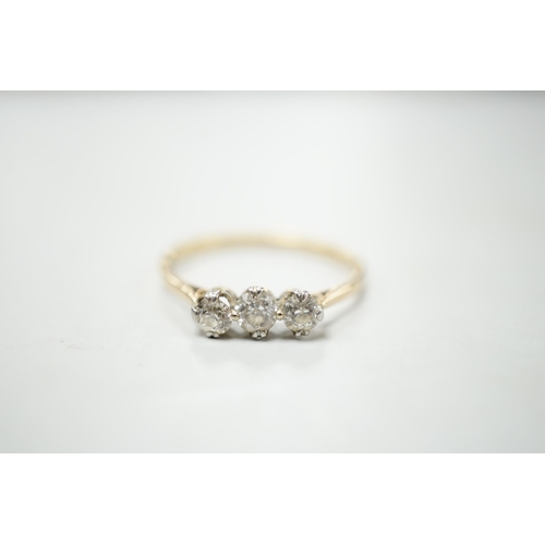 1895 - A yellow metal and three stone diamond set ring, size S/T, gross weight 2.1 grams.