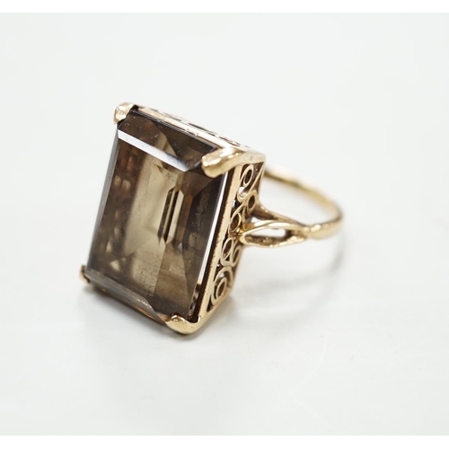 1897 - A 9ct gold and single stone smoky quartz set dress ring, size T, gross weight 8.5 grams.