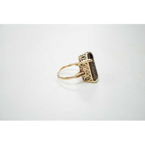 1897 - A 9ct gold and single stone smoky quartz set dress ring, size T, gross weight 8.5 grams.