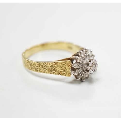 1899 - A modern 18ct gold and diamond chip set flower head cluster ring, size P, gross 4.5 grams.