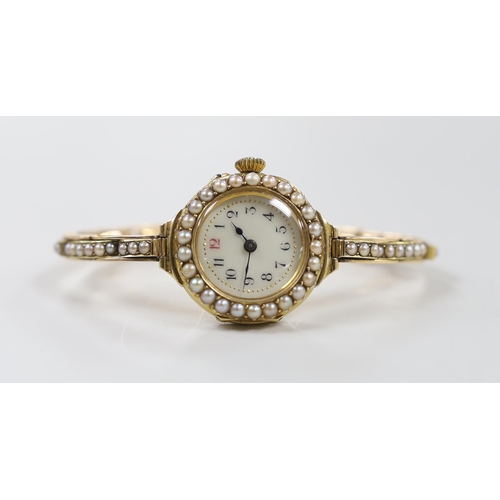 1917 - A lady's early 20th century 18ct gold and seed pearl set manual wind wrist watch, on a flexible 15ct... 