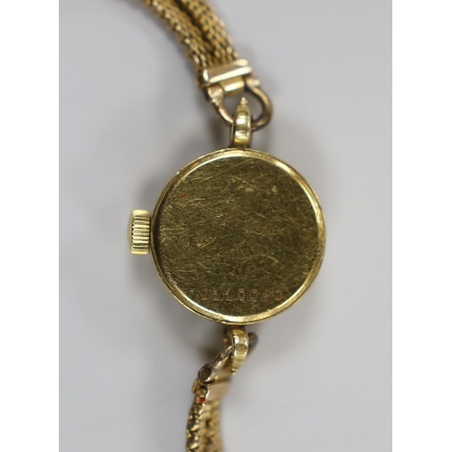 1918 - A lady's yellow metal Girard Perregaux manual wind wrist watch, on a 9ct twin strand bracelet, gross... 