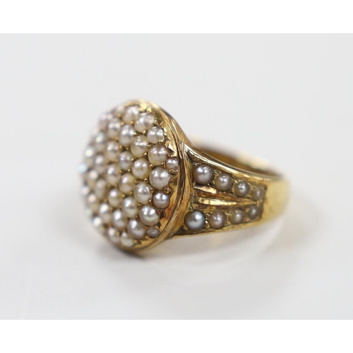 1920 - An Edwardian 15ct and seed pearl cluster set dress ring, with seed pearl set shoulders, size J/K, gr... 