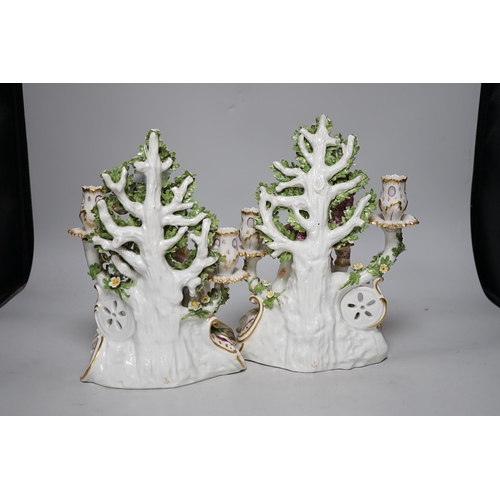 251 - A pair of French porcelain two branch figural candlesticks in the form of musicians, largest 29cm hi... 