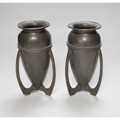 256 - After Archibald Knox, pair of Art Nouveau style hammered pewter vases, 17cm high