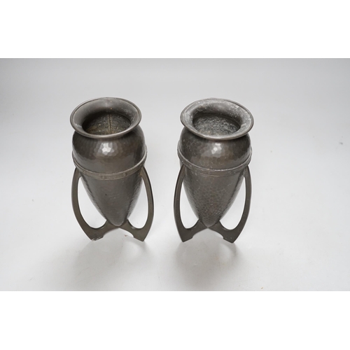 256 - After Archibald Knox, pair of Art Nouveau style hammered pewter vases, 17cm high