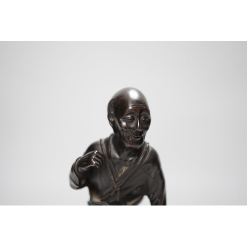 259 - A Japanese bronze figure of an elder, 19th century, 23cm high