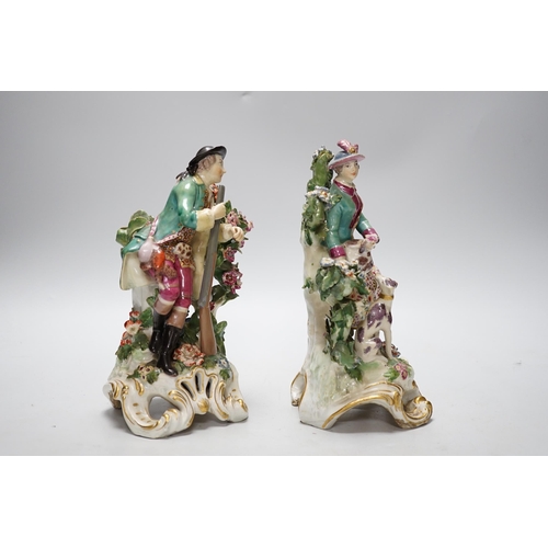 261 - A pair of Chelsea gold anchor period figures wearing 18th century dress, c.1760-65, 22cm