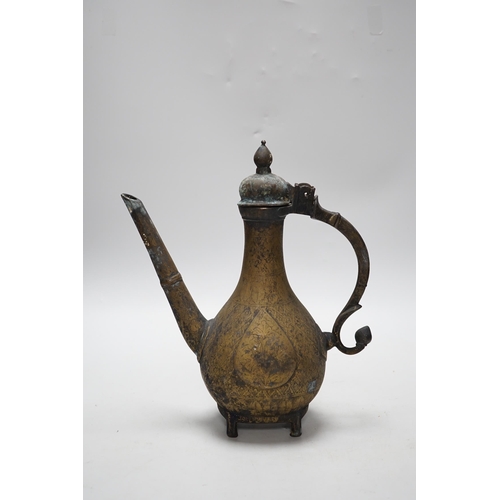 262 - An Indian Islamic brass ewer, 27cm high