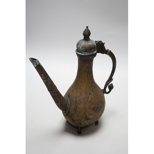 262 - An Indian Islamic brass ewer, 27cm high