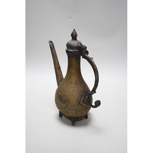 262 - An Indian Islamic brass ewer, 27cm high