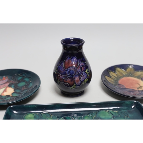 266 - Four Moorcroft small circular dishes, a rectangular dish, and a small vase (6)