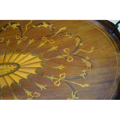 277 - An Edwardian marquetry inlaid oval mahogany two handled tea tray, 63cm