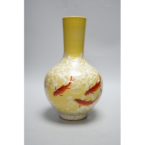 278 - A Japanese glazed vase on yellow ground with carp decoration, 28cm