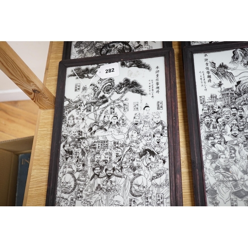 282 - A set of 4 transfer printed Chinese plaques, 28.5cm x 40cm