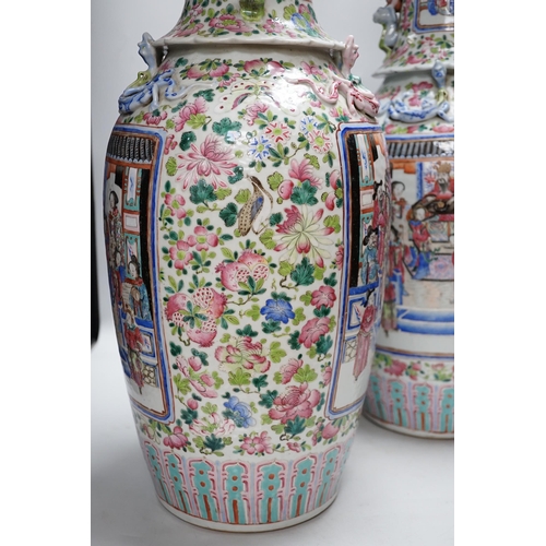 285 - A pair of large Chinese porcelain famille rose vases, 19th century,  decorated with court scenes and... 