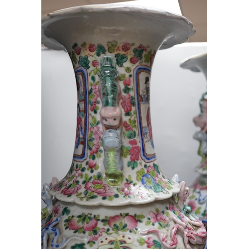 285 - A pair of large Chinese porcelain famille rose vases, 19th century,  decorated with court scenes and... 