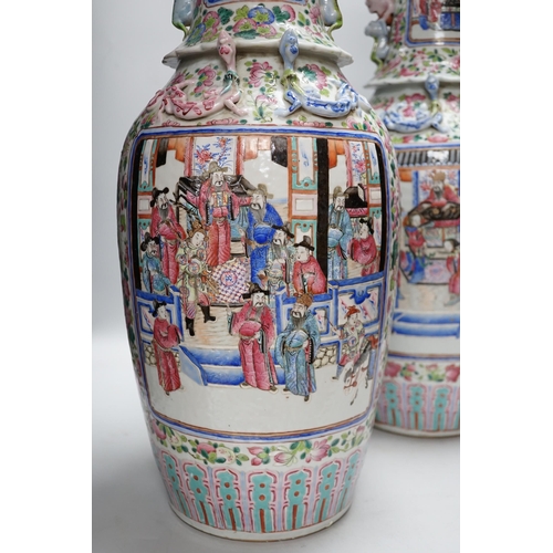 285 - A pair of large Chinese porcelain famille rose vases, 19th century,  decorated with court scenes and... 