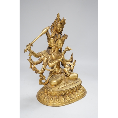 288 - A Sino Tibetan gilt bronze figure of Avalokiteshvara, 34cm high