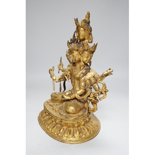 288 - A Sino Tibetan gilt bronze figure of Avalokiteshvara, 34cm high