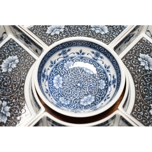 293 - A Chinese porcelain blue and white lazy Susan or supper dish set, 38cm high