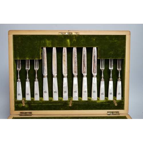 296 - A mahogany case of plated cutlery and part set of mother of pearl handled fruit eaters, largest 46cm... 