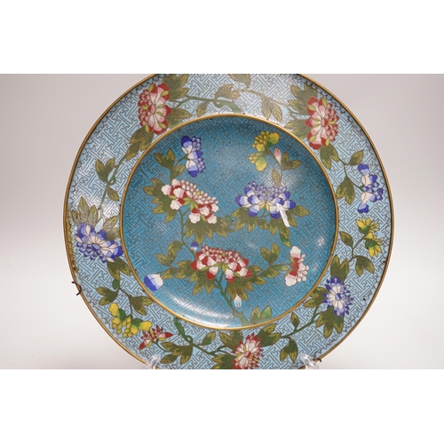 304 - A Chinese Jiaqing period cloisonné enamel dish on a turquoise ground with floral decoration, 27.5cm... 