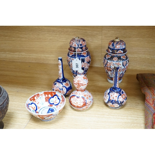 307 - Nine Japanese Imari pieces including; a charger, lidded pot, a bowl, four small gourd vases, two lid... 