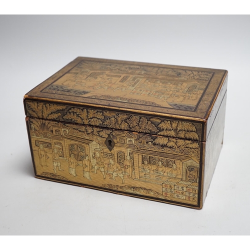 311 - A 19th century Chinese export lacquer tea caddy, black ground with gilt decoration, containing a sep... 