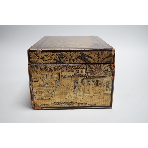 311 - A 19th century Chinese export lacquer tea caddy, black ground with gilt decoration, containing a sep... 